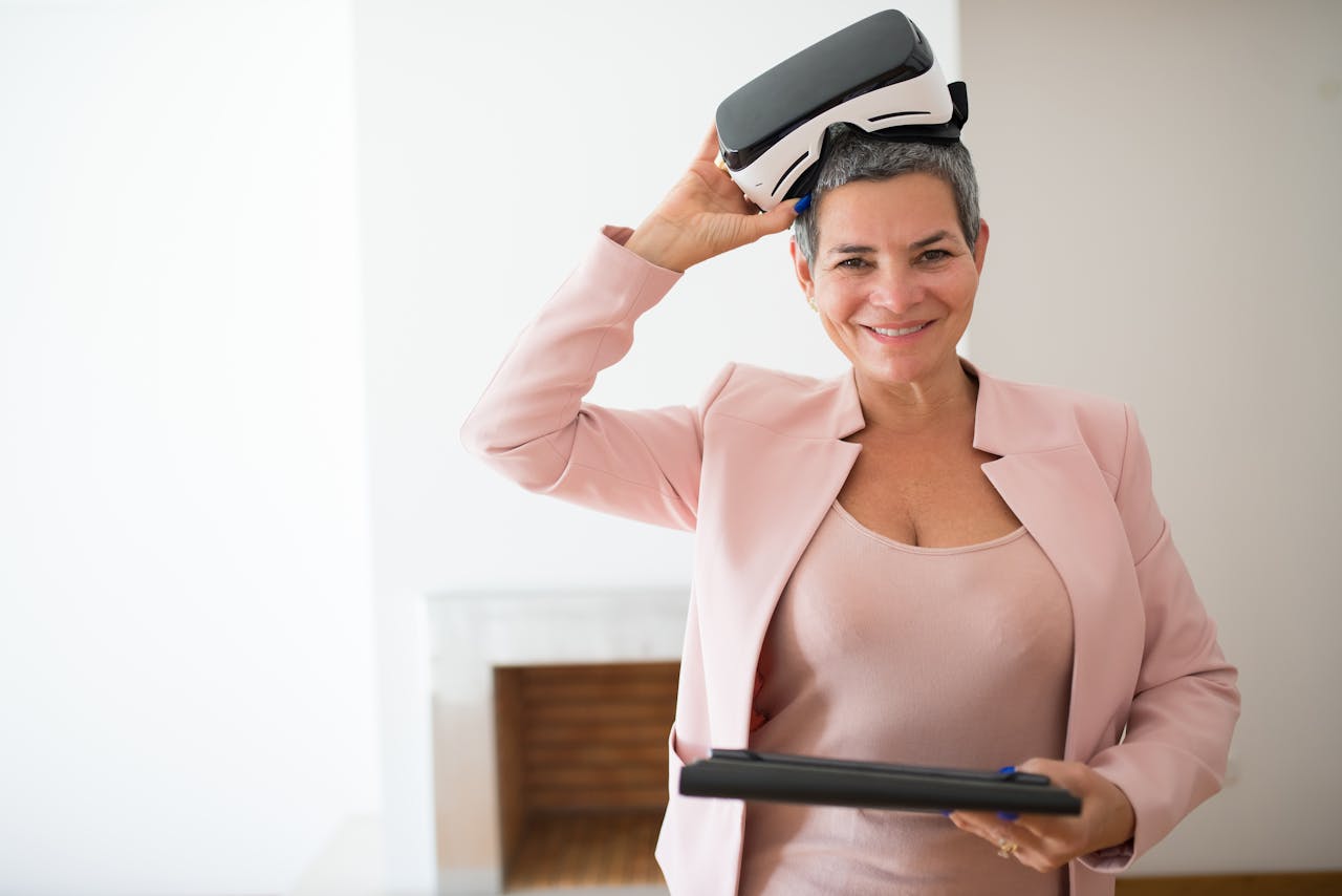 Confident woman in a pink blazer exploring virtual reality indoors. Modern and professional vibe.